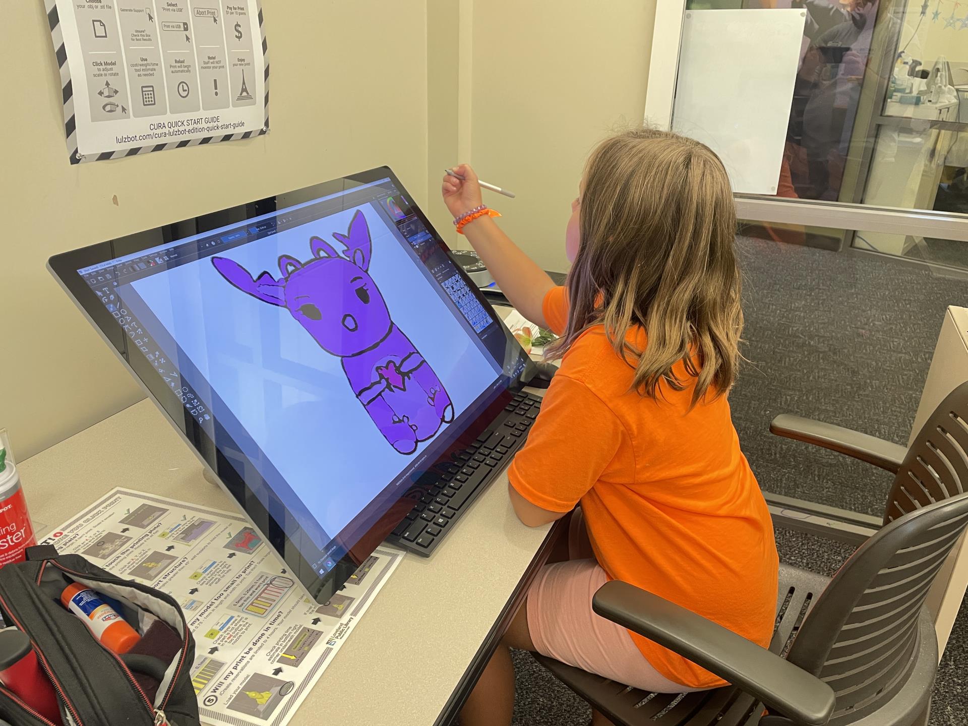 Child drawing on computer