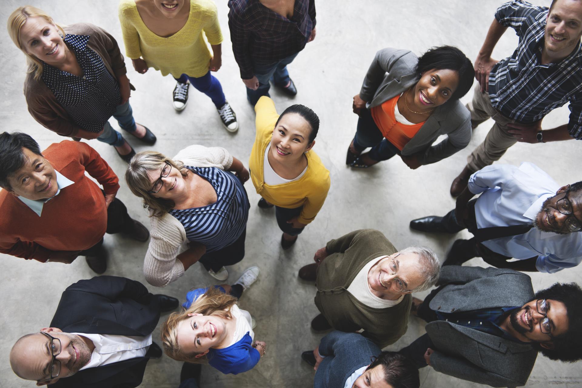 Group of professional adults of varying ages looking up