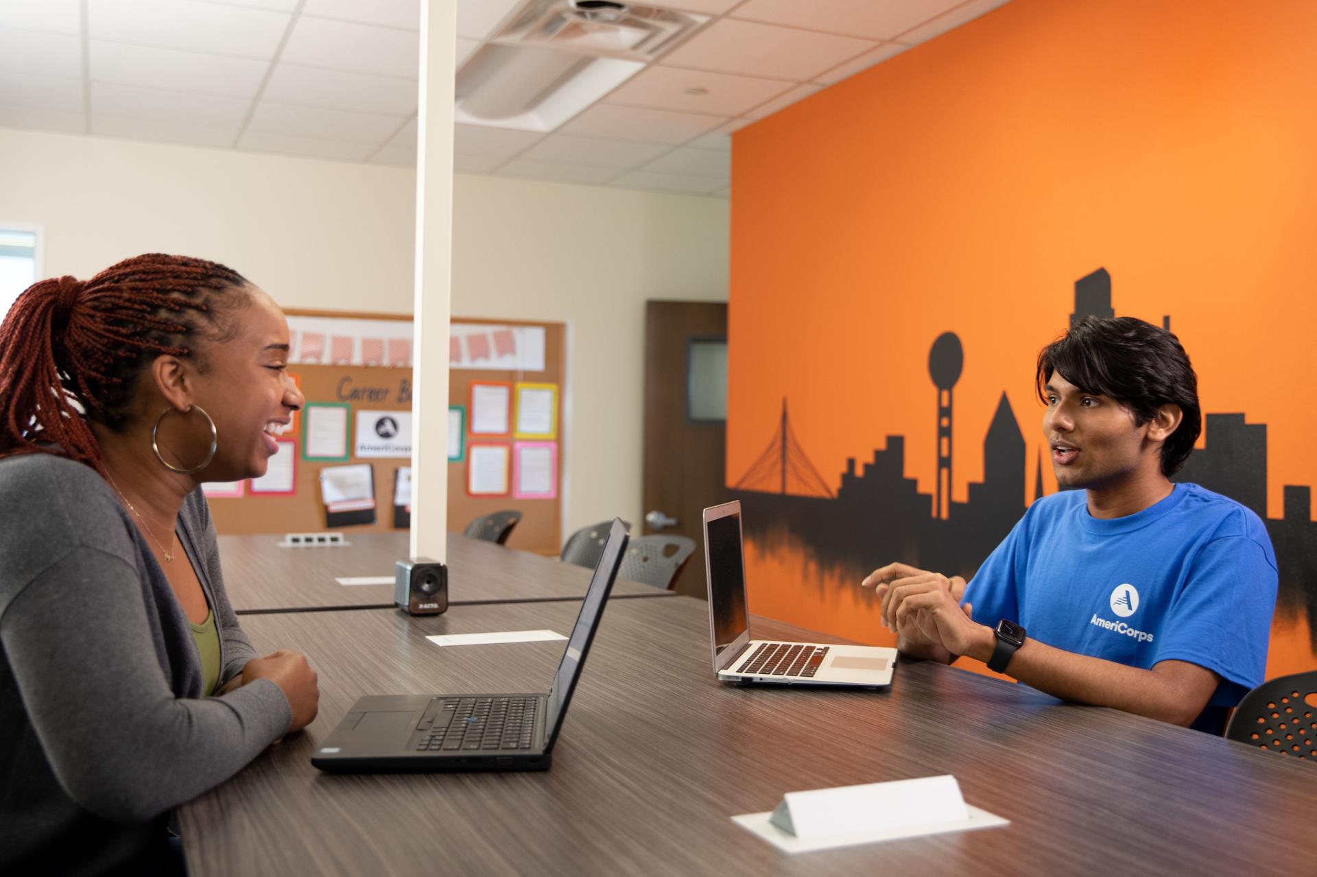 AmeriCorps member helping out another member