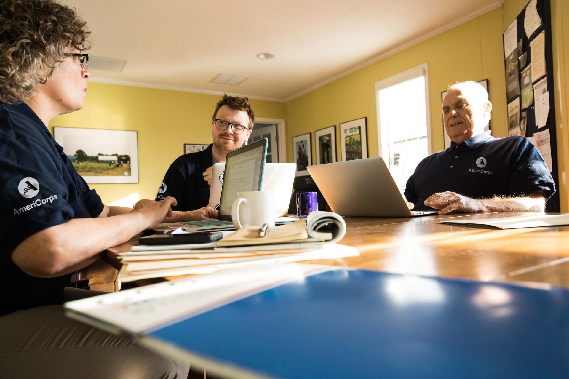 AmeriCorps members working together and planning