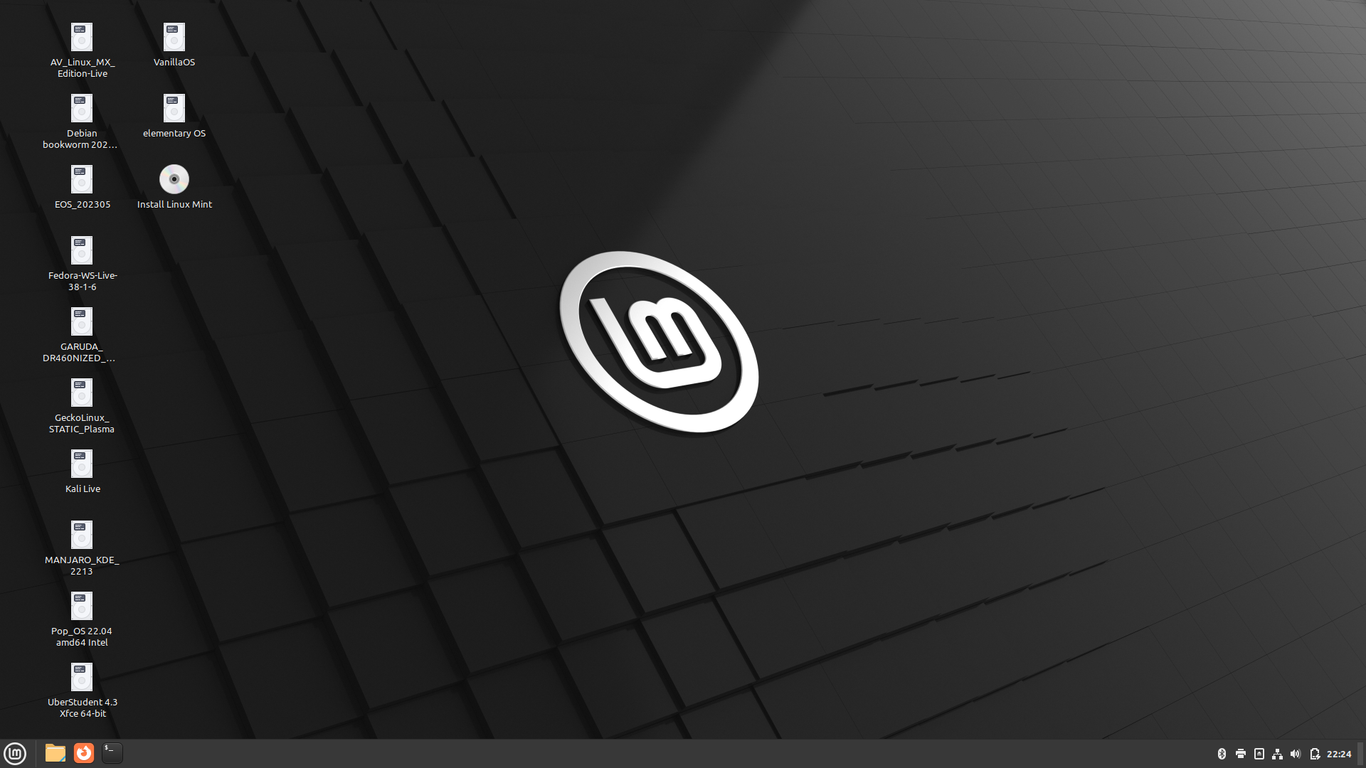 The desktop of a computer with a dark background, a white icon in the center, and icons for files on the left